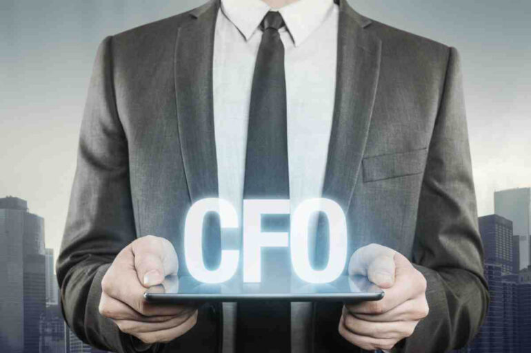 A man holding a CFO sign
