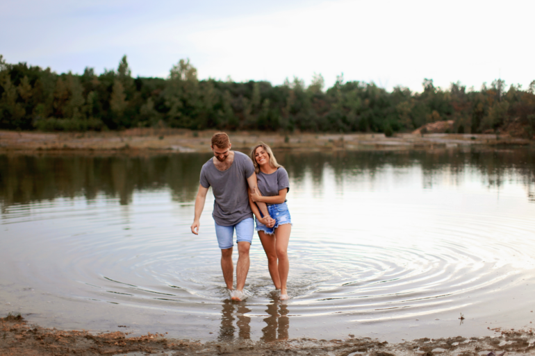 Couple walking in a pond