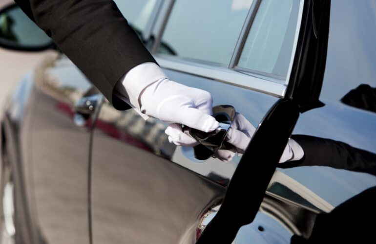 Valet opening a limousine doors