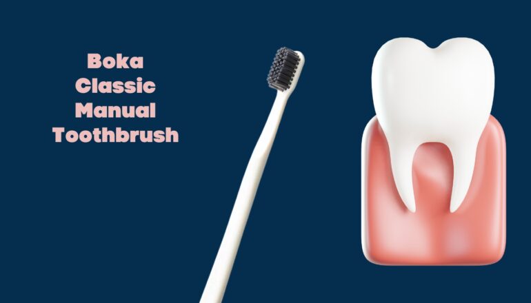 Boka Classic Manual Toothbrush with black bristles next to a healthy tooth and gum illustration, set against a dark blue background