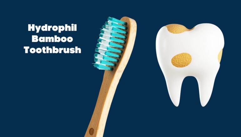 Hydrophil Bamboo Toothbrush with teal and white bristles, alongside an illustration of a decayed tooth, set against a dark blue background