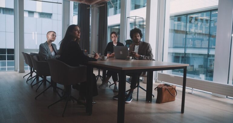 Diverse business team in a corporate setting planning global expansion